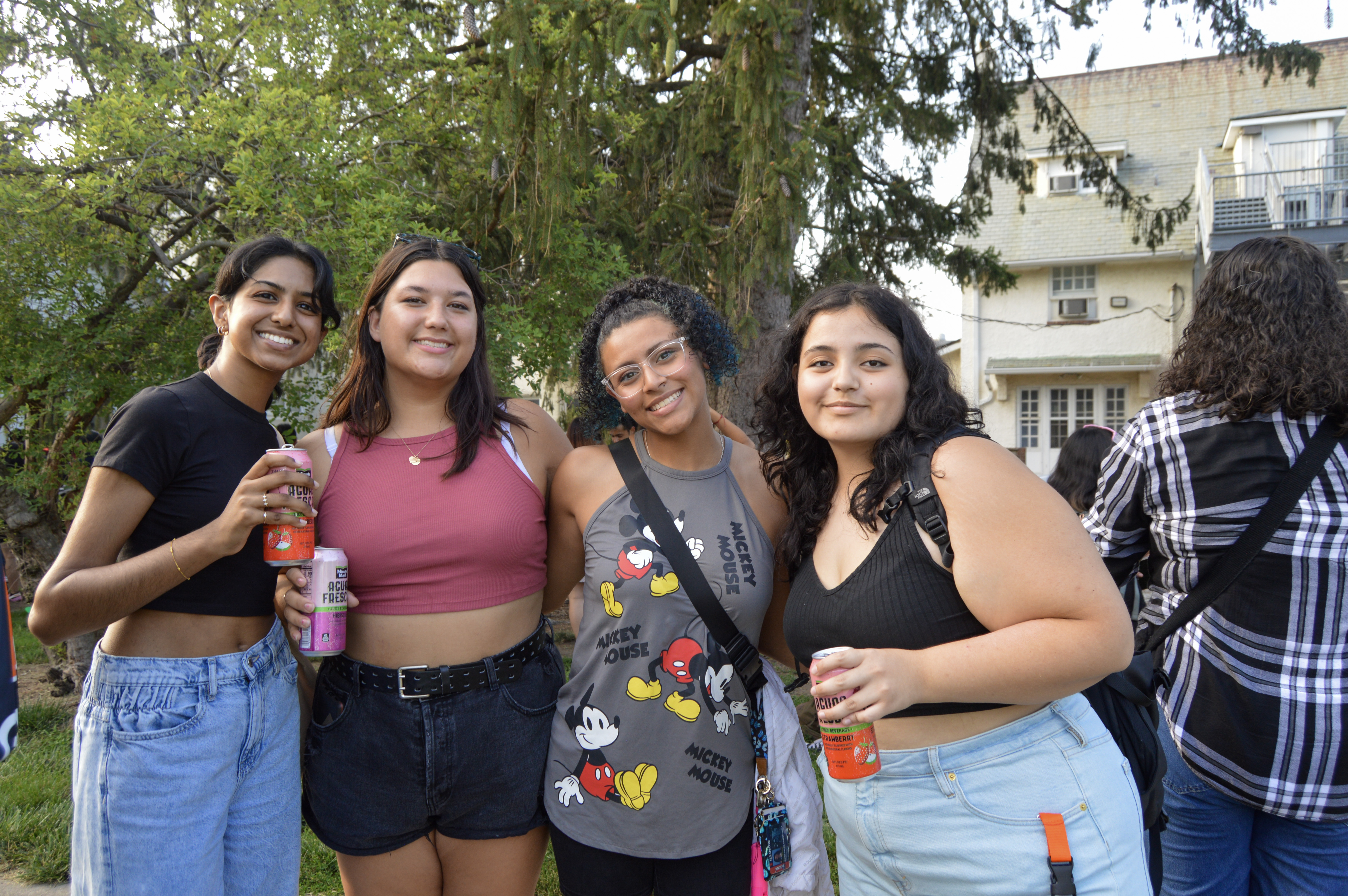 Four Students Posing in La Casa's Backyard during Paleta Social 
